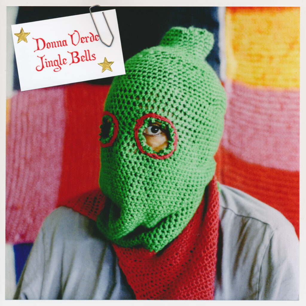 Cover of the Single "Jingel Bells". Picture of Donna Verde. Only her eye is visible. 